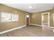 A cozy living room featuring hardwood floors and a large window that brings in natural light at 525 S Keystone Ave, Indianapolis, IN 46203