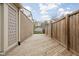 Spacious wooden back deck with a privacy fence and a view of the backyard, perfect for outdoor entertaining at 5802 Crittenden Ave, Indianapolis, IN 46220