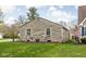 Exterior view of stone house with landscaped yard at 5802 Crittenden Ave, Indianapolis, IN 46220