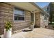 Charming front entrance with flower planters and stone facade at 5802 Crittenden Ave, Indianapolis, IN 46220