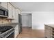 Updated kitchen featuring granite counters, stainless appliances, and wood floors at 5802 Crittenden Ave, Indianapolis, IN 46220
