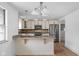 Open kitchen with pendant lighting, stainless appliances, and granite breakfast bar at 5802 Crittenden Ave, Indianapolis, IN 46220