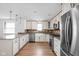 Bright kitchen with granite countertops, stainless appliances, and a farm sink at 5802 Crittenden Ave, Indianapolis, IN 46220