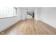 Open-concept living area with hardwood floors and an abundance of natural light at 5802 Crittenden Ave, Indianapolis, IN 46220