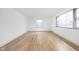 Bright and spacious living area showcasing hardwood floors and large windows at 5802 Crittenden Ave, Indianapolis, IN 46220
