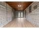 Spacious sunroom features stone walls, a wood ceiling, and access to the exterior at 5802 Crittenden Ave, Indianapolis, IN 46220