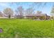 Large backyard and patio area outside of this brick home at 5925 Leisure Ln, Pittsboro, IN 46167