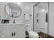 Modern bathroom featuring glass shower, white vanity and toilet at 5925 Leisure Ln, Pittsboro, IN 46167