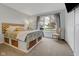 Bedroom with natural light, carpeted floors, and storage baskets under the bed at 5925 Leisure Ln, Pittsboro, IN 46167