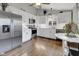 Charming kitchen with white cabinets, stainless appliances, and hardwood flooring at 5925 Leisure Ln, Pittsboro, IN 46167