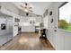 Bright white kitchen with stainless steel appliances, wood floors, and breakfast nook at 5925 Leisure Ln, Pittsboro, IN 46167
