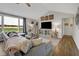Spacious living room with large windows, cozy seating, and modern décor at 5925 Leisure Ln, Pittsboro, IN 46167