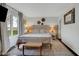 Cozy main bedroom with a decorative rug and bright natural light from the windows at 5925 Leisure Ln, Pittsboro, IN 46167
