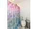 Bathroom with white walls, light gray floors and a blue and pink mermaid-themed shower curtain at 605 Tuscany Trl, Lapel, IN 46051