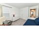 Bedroom featuring a daybed, dresser with a lamp, and a view of another room at 605 Tuscany Trl, Lapel, IN 46051