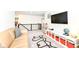 Bright living room with a large TV, toy storage, and comfortable seating area at 605 Tuscany Trl, Lapel, IN 46051