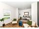 Inviting living area with wood floors, tasteful decor, and window with bright natural light at 605 Tuscany Trl, Lapel, IN 46051