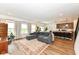 Open concept living room boasts hardwood floors, natural light, and comfortable seating area at 605 Tuscany Trl, Lapel, IN 46051