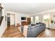 Open-concept living room offers plush seating and hardwood floors for comfortable gatherings at 605 Tuscany Trl, Lapel, IN 46051