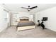 Spacious bedroom featuring a large bed, two windows, and a Peloton exercise bike at 605 Tuscany Trl, Lapel, IN 46051