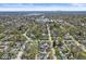 Aerial view of a tree-lined neighborhood filled with well-maintained homes and manicured landscaping at 6153 Evanston Ave, Indianapolis, IN 46220