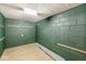 Unfinished basement with green walls, modern flooring and open space for customization at 6153 Evanston Ave, Indianapolis, IN 46220