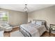Cozy bedroom with hardwood floors, neutral walls, and natural light, providing a comfortable retreat at 6153 Evanston Ave, Indianapolis, IN 46220