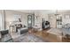 Well-lit living room featuring hardwood floors, a comfortable seating arrangement, and stylish decorative accents at 6153 Evanston Ave, Indianapolis, IN 46220
