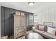 Comfortable living area with a large armoire, neutral colors, and bright natural light at 6153 Evanston Ave, Indianapolis, IN 46220