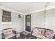 Cozy porch with comfortable seating, perfect for relaxing and enjoying the peaceful surroundings at 6153 Evanston Ave, Indianapolis, IN 46220