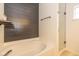 Modern bathroom featuring a soaking tub, shower, stylish wall paneling and neutral decor at 6328 Dusty Laurel Dr, Whitestown, IN 46075