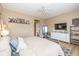 Cozy bedroom featuring a ceiling fan, white dresser, mirror, and tasteful decor at 6328 Dusty Laurel Dr, Whitestown, IN 46075