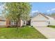 Charming single-Gathering home with a well-manicured lawn and attached two-car garage at 6328 Dusty Laurel Dr, Whitestown, IN 46075