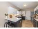 Modern kitchen featuring white cabinets, stainless steel appliances, and a stylish breakfast bar at 6328 Dusty Laurel Dr, Whitestown, IN 46075