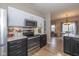Bright, modern kitchen with stainless steel appliances and a convenient pass-through to the dining area at 6328 Dusty Laurel Dr, Whitestown, IN 46075