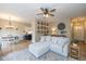 Bright living room featuring a plush sectional, modern ceiling fan, and open layout at 6328 Dusty Laurel Dr, Whitestown, IN 46075