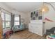 Bright playroom with large windows, built-in storage, seating area, and modern lighting at 6328 Dusty Laurel Dr, Whitestown, IN 46075