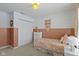 Comfortable bedroom featuring two-tone walls, plush carpet, and a spacious closet at 6586 W Winding Bnd, McCordsville, IN 46055