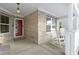 Inviting front porch with brick facade and rocking chairs, perfect for relaxing at 6586 W Winding Bnd, McCordsville, IN 46055