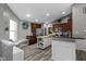 Spacious kitchen with wood cabinets, a central island, and modern appliances at 6586 W Winding Bnd, McCordsville, IN 46055