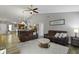Open-concept living area with modern furnishings and hardwood floors connecting to kitchen at 6586 W Winding Bnd, McCordsville, IN 46055