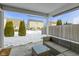 Covered patio features comfortable outdoor furniture and view of snowy backyard at 6586 W Winding Bnd, McCordsville, IN 46055