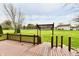 View of the spacious wood deck in the backyard, complemented by lush green lawn and landscaping at 6591 Rushing, Noblesville, IN 46062