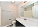 A bathroom featuring a single sink vanity with a large mirror and wood look floors at 6591 Rushing, Noblesville, IN 46062