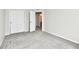 A bedroom featuring neutral walls and carpet flooring with doors to other rooms at 6591 Rushing, Noblesville, IN 46062