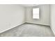 A bedroom featuring neutral walls, carpet flooring, and a window at 6591 Rushing, Noblesville, IN 46062