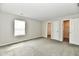 A bedroom featuring neutral walls, carpet flooring, a window, and a closet at 6591 Rushing, Noblesville, IN 46062