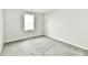 A bedroom featuring neutral walls, carpet flooring, and a window at 6591 Rushing, Noblesville, IN 46062