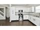 This kitchen features stainless steel appliances, granite countertops, and white cabinets at 6591 Rushing, Noblesville, IN 46062
