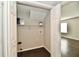 Bright laundry closet with laminate flooring, shelving, and white painted walls at 6591 Rushing, Noblesville, IN 46062